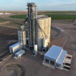 Holcomb Grain Facility's 92-foot-tall concrete structure with integrated loop track system for efficient rail operations and bulk grain handling, designed by KC Engineering.